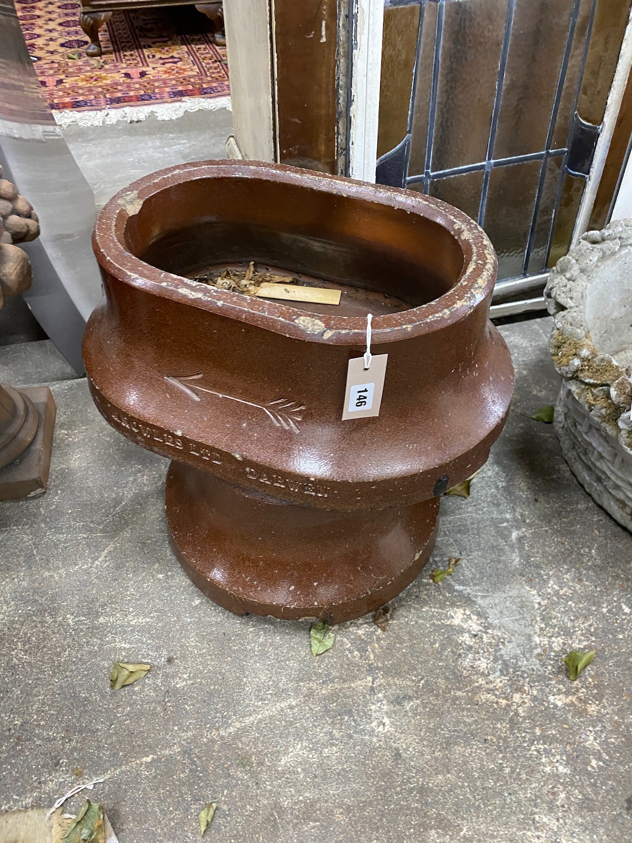 A pair of early 20th century oval salt glazed golfer's divot troughs, by Knowles Ltd., Darwen, width 49cm, depth 34cm, height 20cm